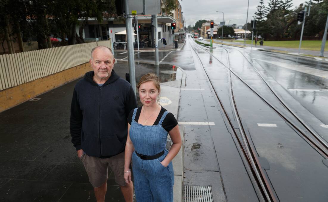 CYCLING CONCERNS: Peter Johnston, owner of 23hundred espresso bar, and employee Rosie Scanlan beside the light rail tracks on Scott Street. 