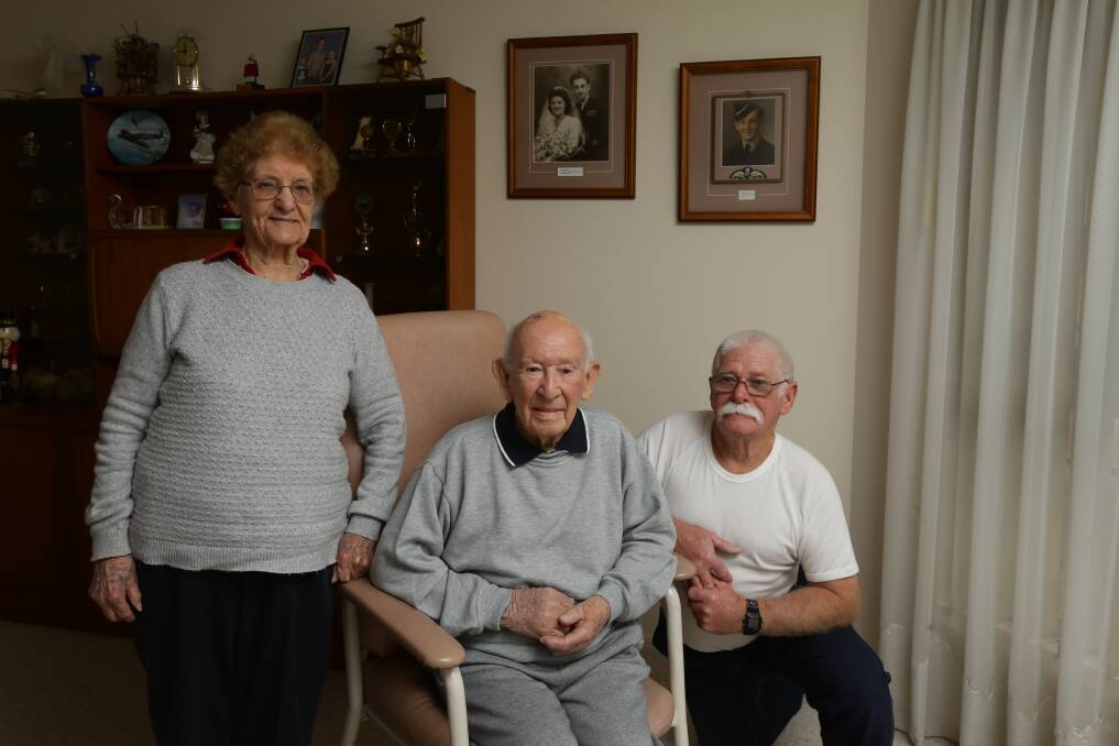World War Two Spitfire pilot Clem Jones, centre, with wife Freda and son Chris. Picture: Jonathan Carroll 