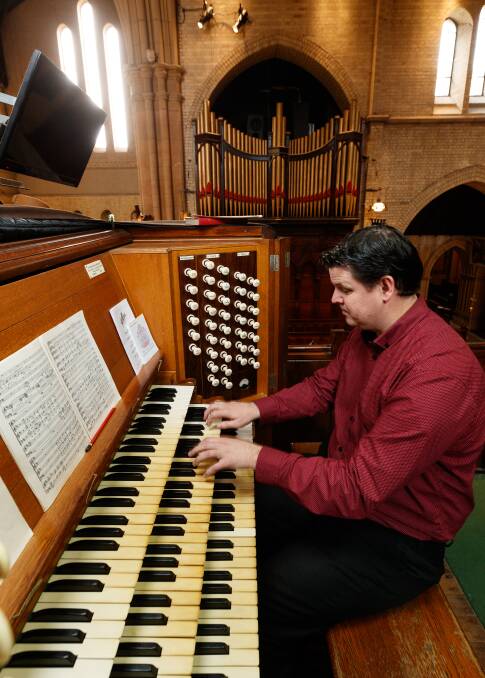 PRIVILEGE: Peter Guy playing the historic pipe organ in Christ Church Cathedral.