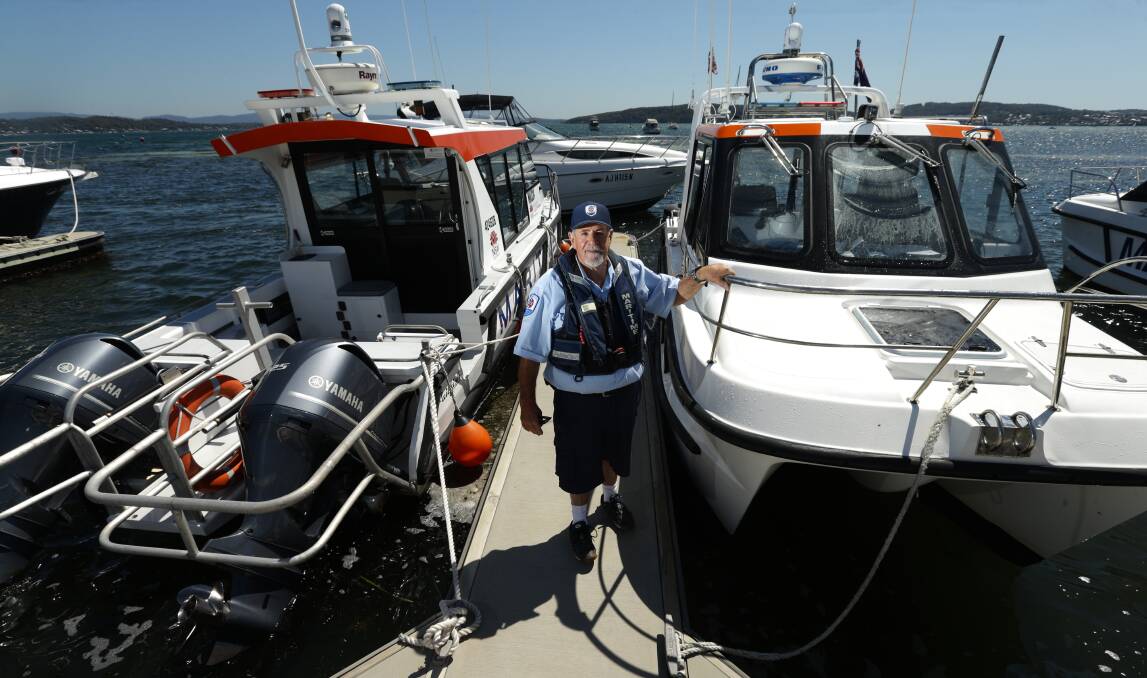 NSW Maritime boating safety officer Peter Browne with his 7.6-metre vessel at Marks Point. Picture: Jonathan Carroll