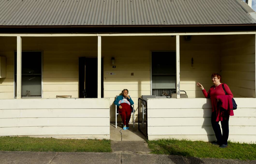 LOCALS: Judy Watt, sitting on the veranda of her home of 68 years, talks with historian and author Julie Keating. Picture: Jonathan Carroll 