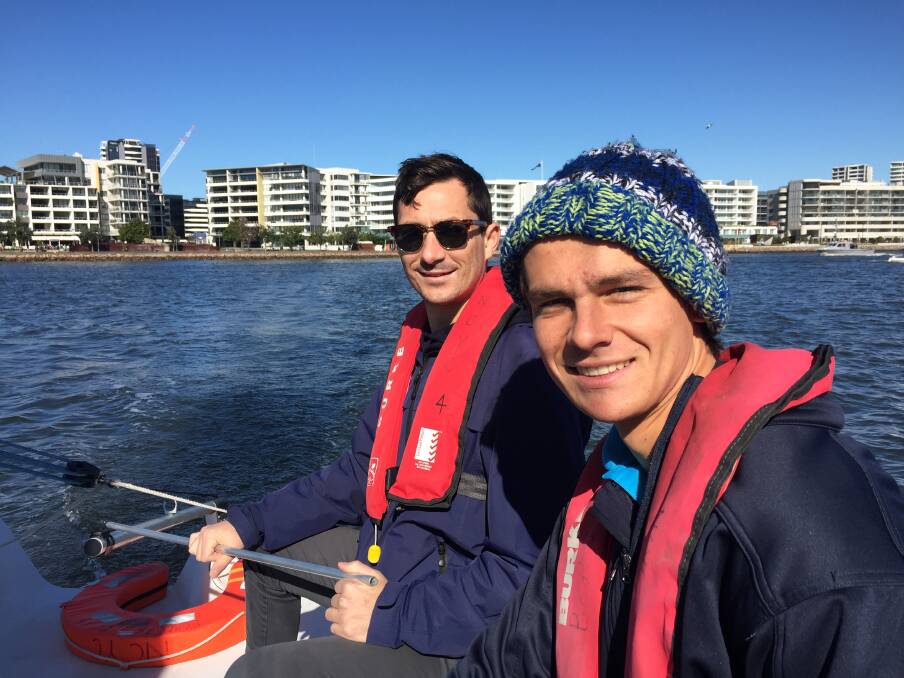 Matt Williams and Hugo Hamilton, from Newcastle Cruising Yacht Club, sailing on the harbour. Picture: Scott Bevan