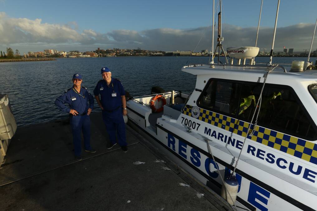 Marine Rescue Newcastle's Rick Nevile and Ron Calman on the wharf at Stockton. Picture: Jonathan Carroll 