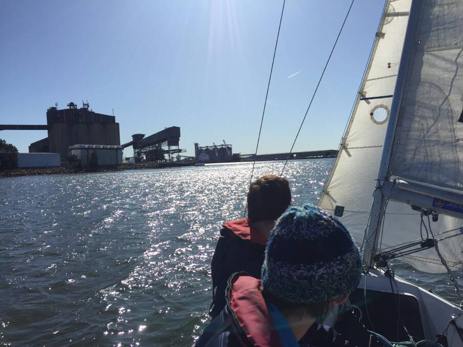 Sailing in The Basin, with grain silos in the background. Picture: Scott Bevan