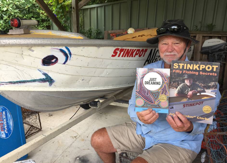 PORT WORDSMITH: Author John "Stinker" Clarke holds his two new books, which feature his beloved home area.