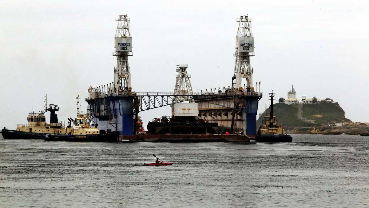 The floating dock "Muloobinba" leaving Newcastle harbour in 2012. Picture: Simone De Peak