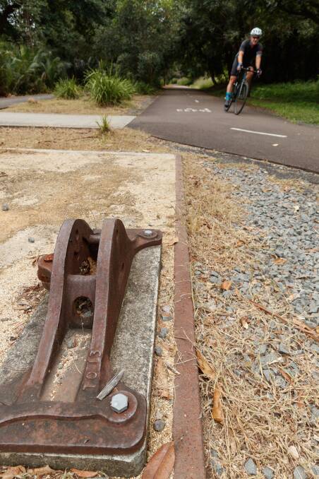 Rail artefact and a cyclist on the Fernleigh Track. Picture: Max Mason-Hubers 