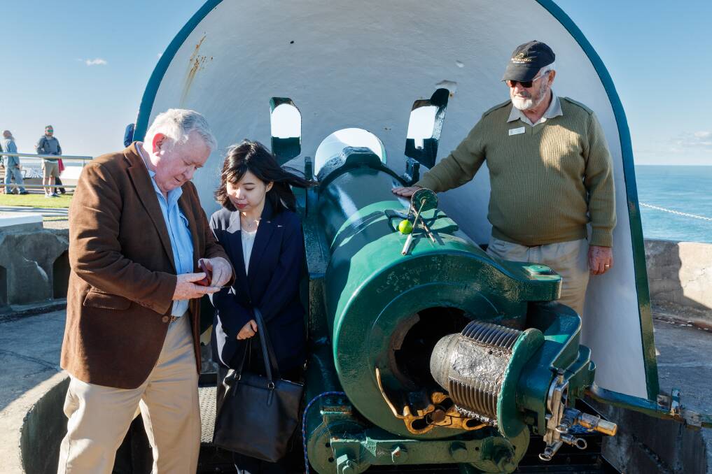 SHARED STORY: Fort Scratchley Historical Society president Frank Carter shows an artefact to Japanese vice-consul Minako Tateno. 