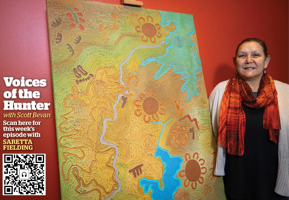 CULTURAL MAP: Artist Saretta Fielding with her painting, "Yarns Parai: Stories on Country", with Lake Macquarie at the bottom of the work. Picture: Courtesy, Saretta Fielding and Lake Macquarie City Council