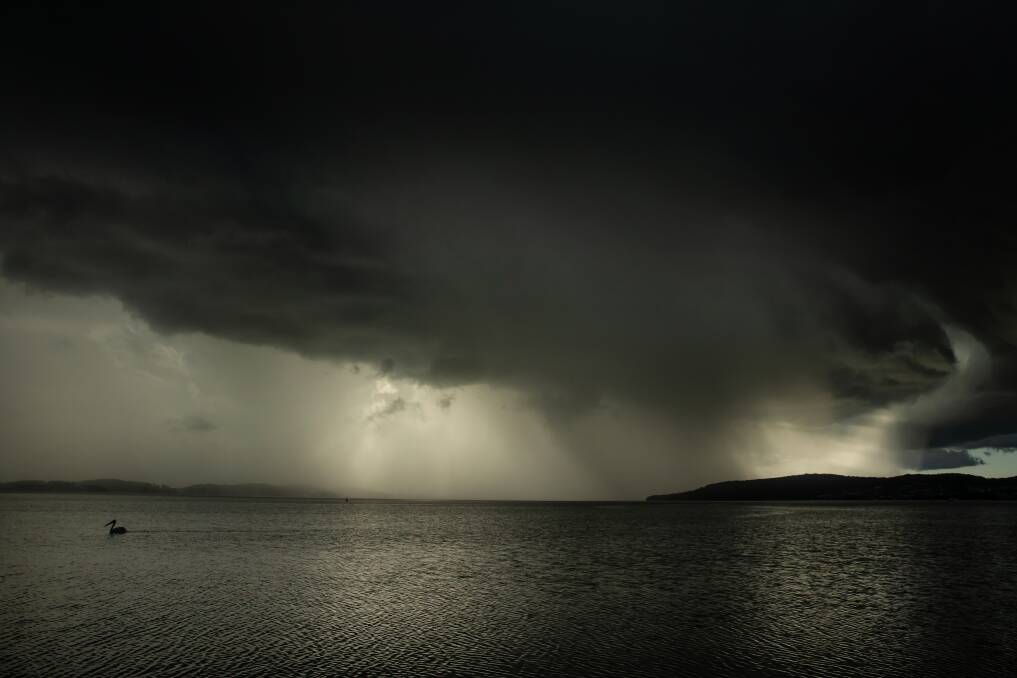 Storm clouds over Lake Macquarie, from Belmont South. Picture: Marina Neil 
