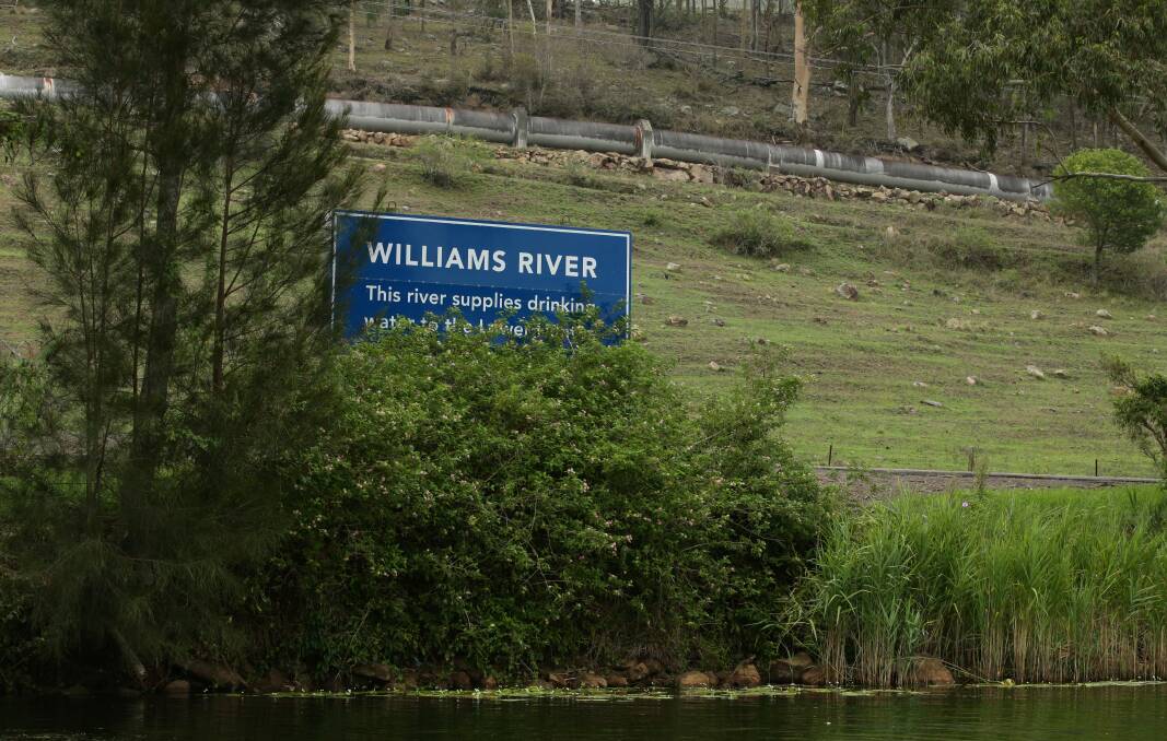 A sign pointing out this section of the Williams River supplies drinking water. Picture: Simone De Peak