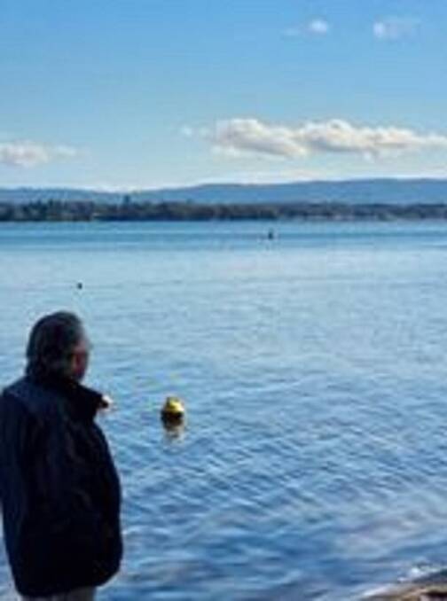 Summerland Point resident Brian Walker looking across the lake to communities not subject to the lockdown. Picture: Courtesy, Brian Walker 