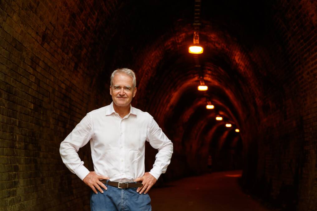 Writer Scott Bevan at the entrance to the tunnel on the Fernleigh Track. Picture: Max Mason-Hubers 