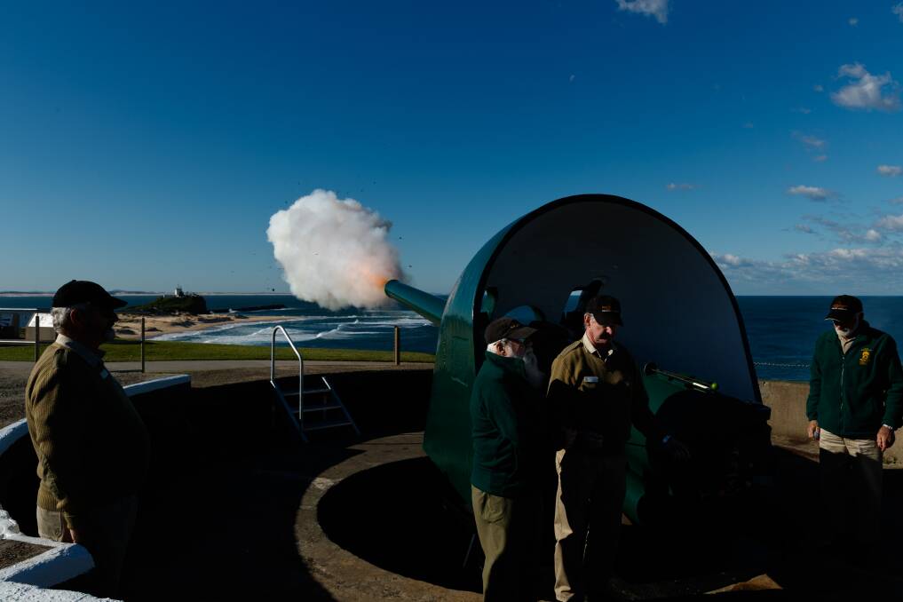 FIRE!: Fort Scratchley's gun bursts into life at the commemorative event. 