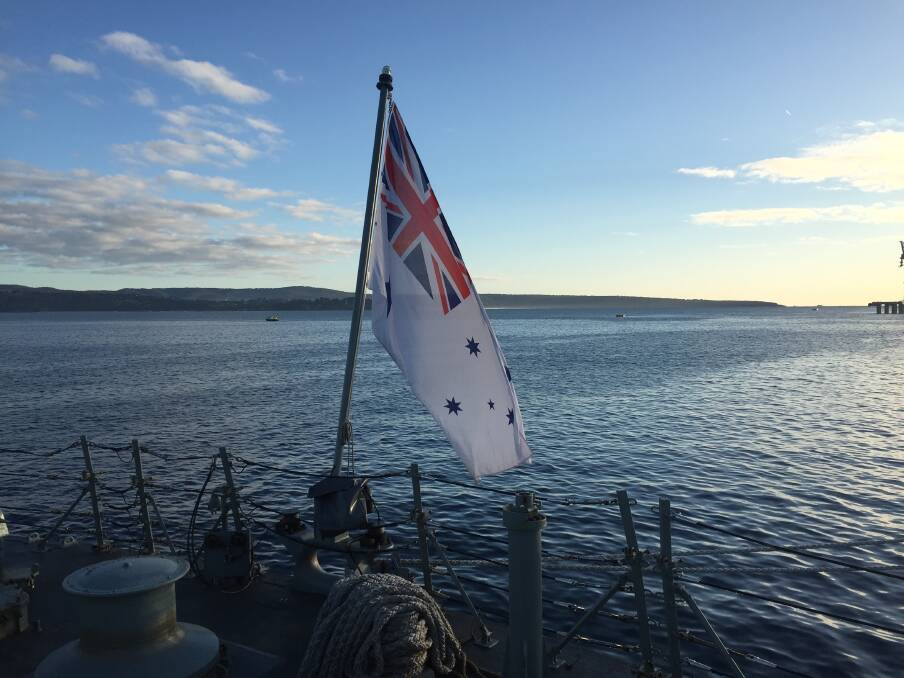 Australian white ensign and Twofold Bay. Picture: Scott Bevan