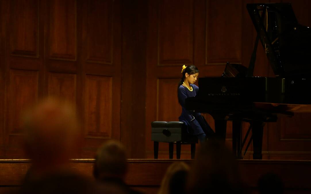 PERFORMANCE: Chloe Lim, aged 9, playing the new grand piano at the lunchtime concert in City Hall. Picture: Jonathan Carroll
