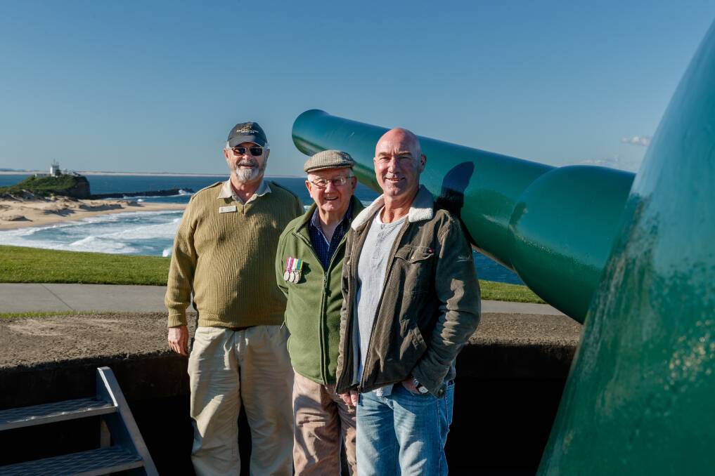 RELIVING HISTORY: Neil Robinson, Grahame Pricter and son Roger Pricter at Fort Scratchley, where their loved ones were serving on the night in 1942 when a Japanese submarine shelled Newcastle. Pictures: Max Mason-Hubers 