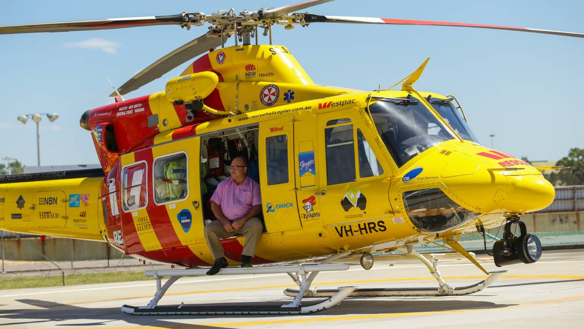 SERVICE: Richard Jones in the rescue helicopter in 2017, when he was awarded a Medal of the Order of Australia (OAM), for outstanding service to the Hunter community. Picture: Jonathan Carroll