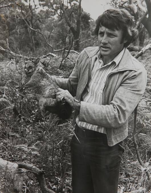  Brian Gilligan, in his teaching days at the Awabakal Field Study Centre, holds a possum. Picture: Supplied 