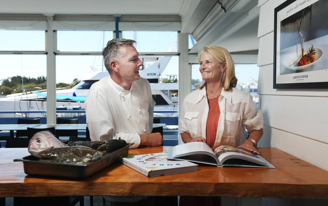 PUTTING WORDS IN THE MOUTH: Chef Ludovic Poyer and author Lynda Sloan inspect the fresh seafood and new book, "Port to Plate", at The Poyer's restaurant at Lemon Tree Passage. Pictures: Simone De Peak 