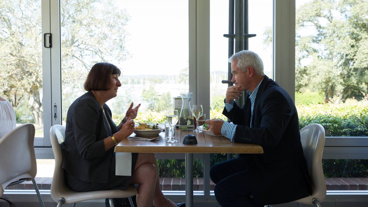 LAKESIDE: Mayor Kay Fraser and Scott Bevan talking over lunch, and with a view of the water, at Awaba House in Booragul. Picture: Max Mason-Hubers