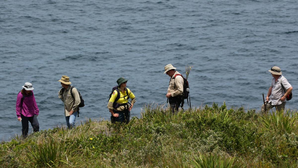 A team of rangers and scientists (and one journalist) on Broughton Island. Picture: Jonathan Carroll