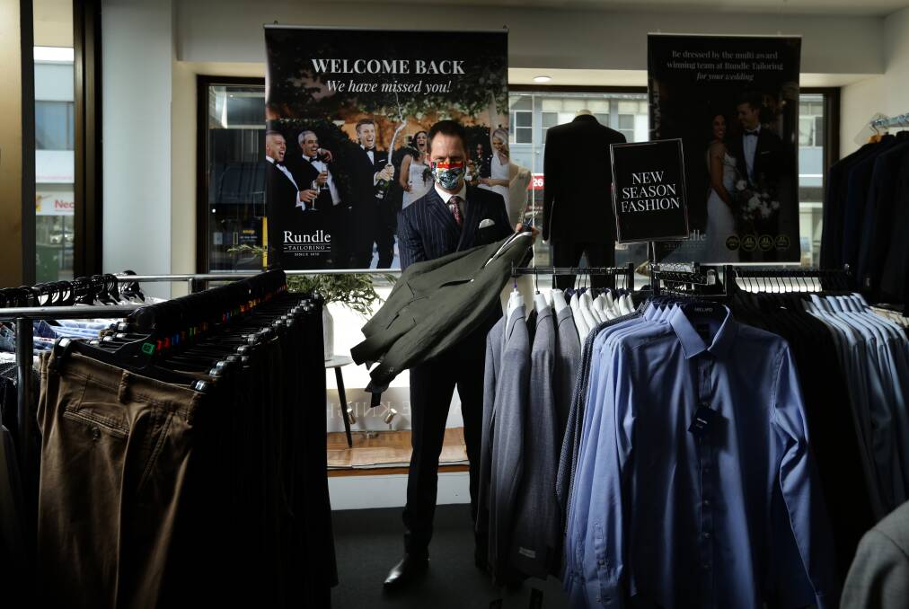 Andrew Rundle prepares his store, Rundle Tailoring, for the doors to open once more to customers. Picture: Jonathan Carroll