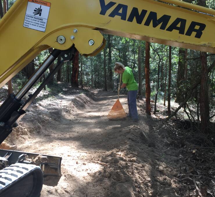 Coleen Kehoe helps prepare a track at the Awaba Mountain Bike Park. Picture: Scott Bevan
