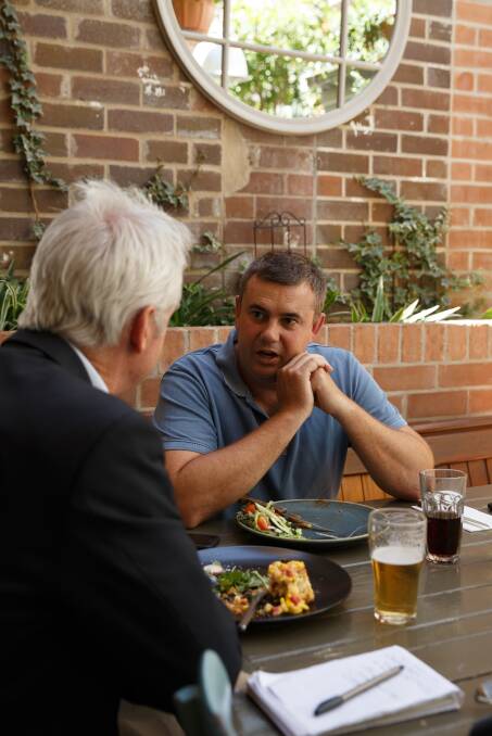 Nathan Towney talking with Scott Bevan over lunch in Cooks Hill. Picture: Max Mason-Hubers.