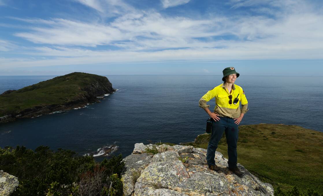 CLEAR VIEW: National Parks & Wildlife Service ranger Susanne Callaghan on Broughton Island's highest point. Picture: Jonathan Carroll