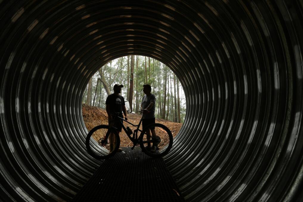 SEEING THE LIGHT: Rick Kehoe and Dallas Barham in a tunnel near the start of the new mountain bike track. Pictures: Jonathan Carroll