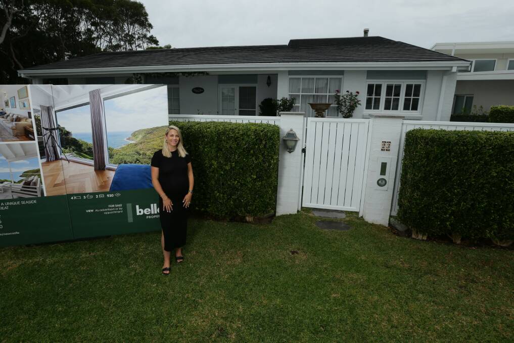 Real estate agent Katie Kepner outside a property for sale in Dudley. Picture: Jonathan Carroll 