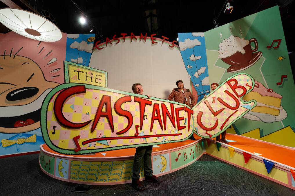 COLOURFUL: Artist Michael Bell, curator David Hampton and Newcastle Museum director Julie Baird hold the recreated Castanet Club sign. Picture: Max-Mason Hubers 