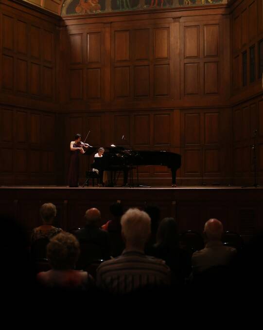 LUNCH BREAK: Violinist Catherine Sheng-Cooper and pianist Mercia Buck perform at the free concert in City Hall on Wednesday. Picture: Simone De Peak