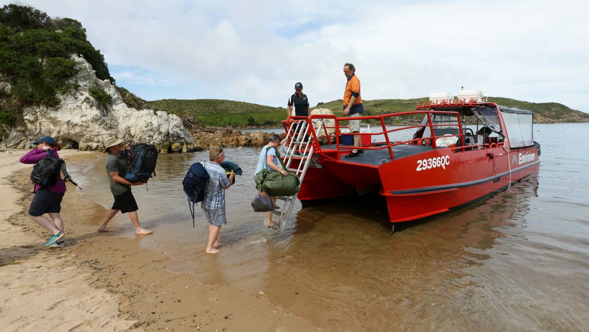 Passengers arrive and leave the island by boat. Picture: Jonathan Carroll 