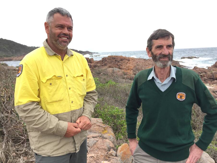 LOOKING AHEAD: Jamie Tarrant and Andrew Bond, from the NSW National Parks and Wildlife Service, at Big Rocky, along the proposed coastal walk.