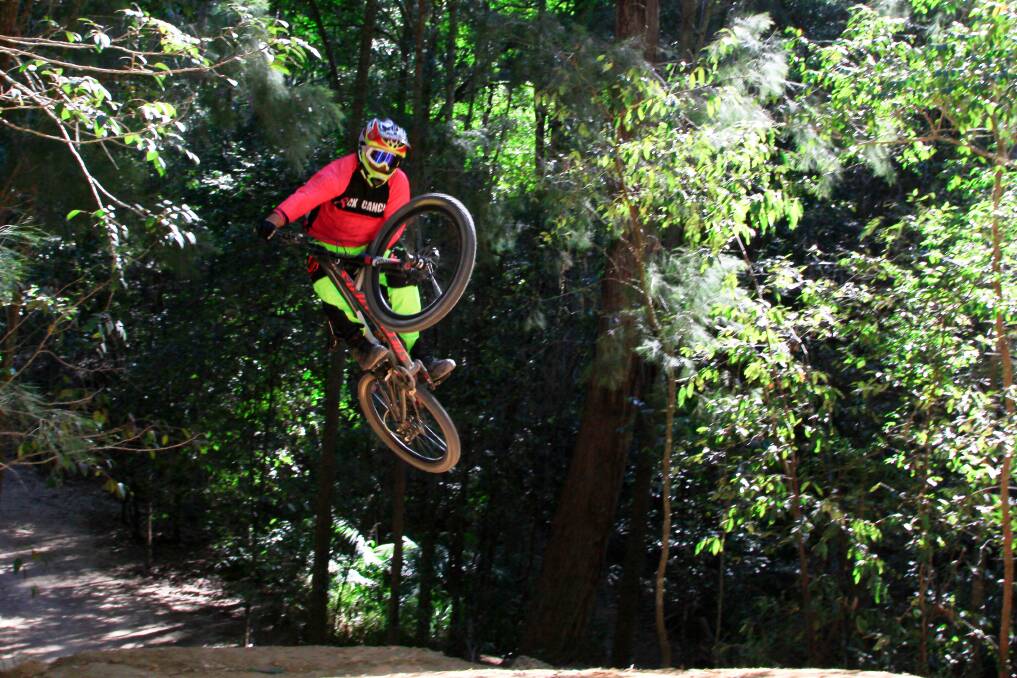 Rick Kehoe flies high at the Awaba Mountain Bike Park. Picture: Courtesy, Hunter Mountain Bike Association