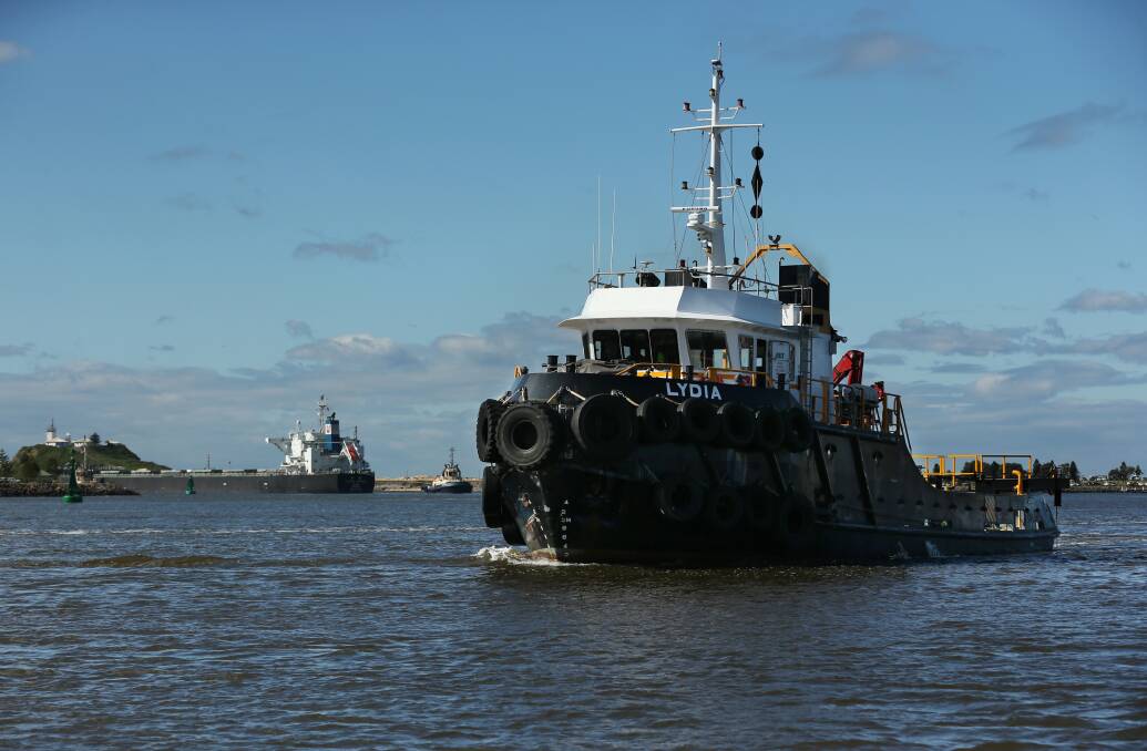 The sweeper vessel 'Lydia' working at the Horeshoe, as a ship departs the port. Picture by Simone De Peak