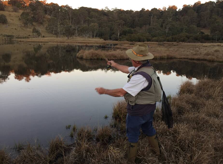 Charles Atkin fly fishing at twilight. Picture: Scott Bevan