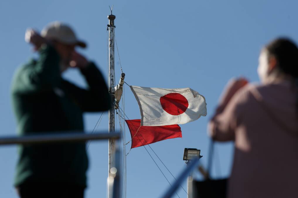 The Japanese flag flying during the gun-firing ceremony at Fort Scratchley. Picture: Max Mason-Hubers 