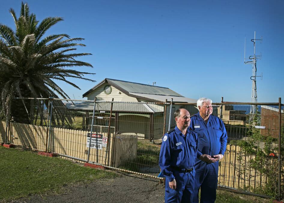 ADRIFT: Marine Rescue Newcastle member Graham Silcock and the unit's commander Ron Calman outside the Shepherds Hill cottage in 2016. Picture: Marina Neil 