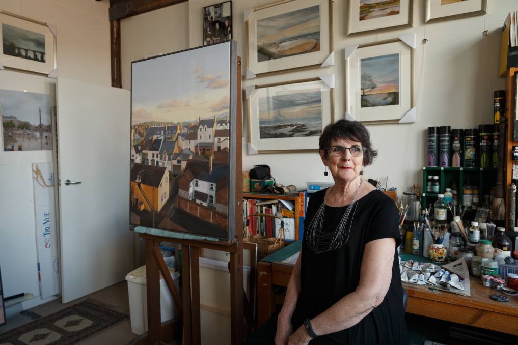 Artist Kerrie Coles in her home studio, with a 2018 painting of Llandudno, Wales on the easel. Picture: Max Mason-Hubers