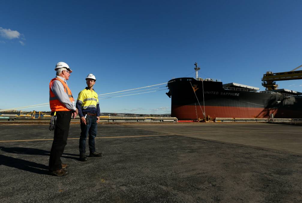 Trevor Simmons and Andrew Dobbie at the Port Waratah Coal Services terminal on Kooragang Island. Picture: Jonathan Carroll