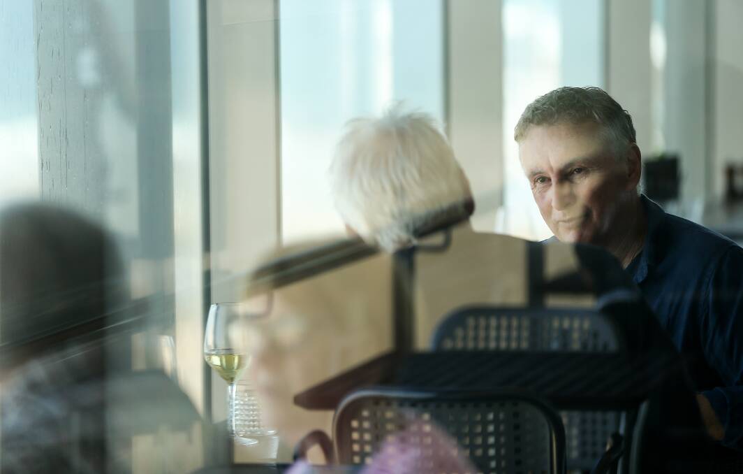 REFLECTION: Newcastle Jets coach Ernie Merrick at lunch with Scott Bevan at Merewether Surfhouse. Picture: Marina Neil