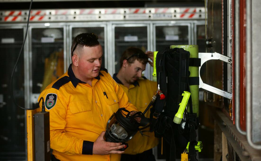 PREPARED: Lachlan Martin and Josh Fraser checking equipment at the station. Picture: Jonathan Carroll