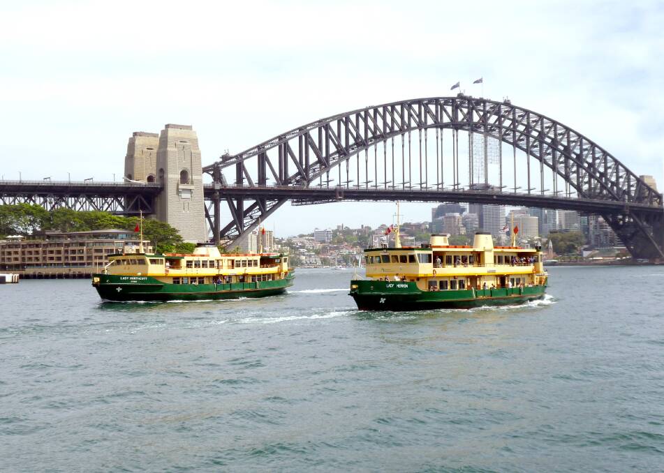 Lady Northcott and Lady Herron passing each other near Circular Quay on Sydney Harbour. Picture: Courtesy, Bill Allen
