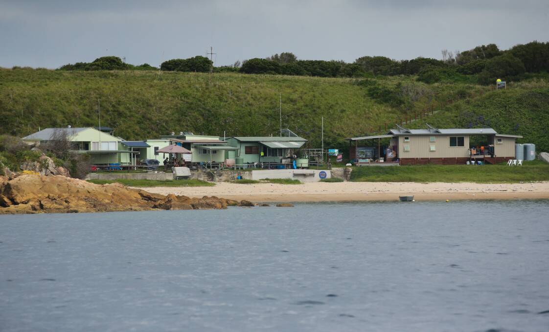 The string of huts at the head of Esmeralda Cove. Picture: Jonathan Carroll
