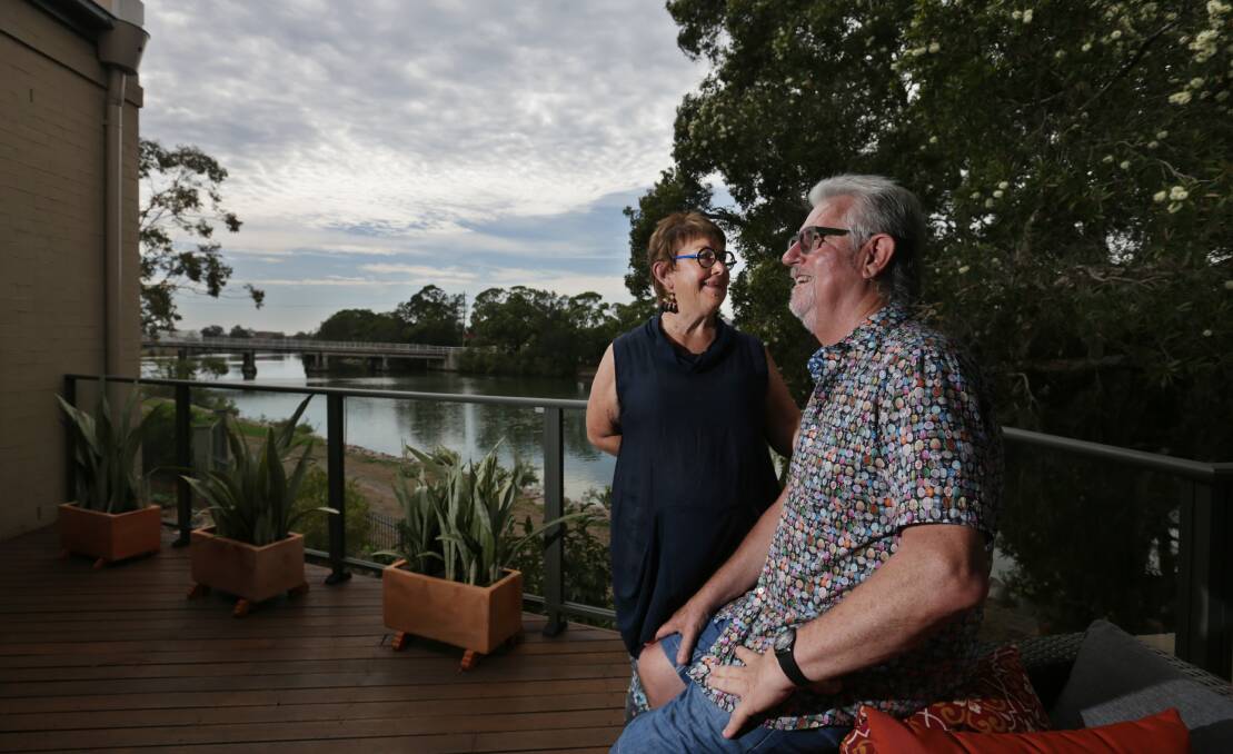 Tighes Hill residents Barbara and Leigh Wardle on the veranda of their home that overlooks Throsby Creek. Picture: Simone De Peak 
