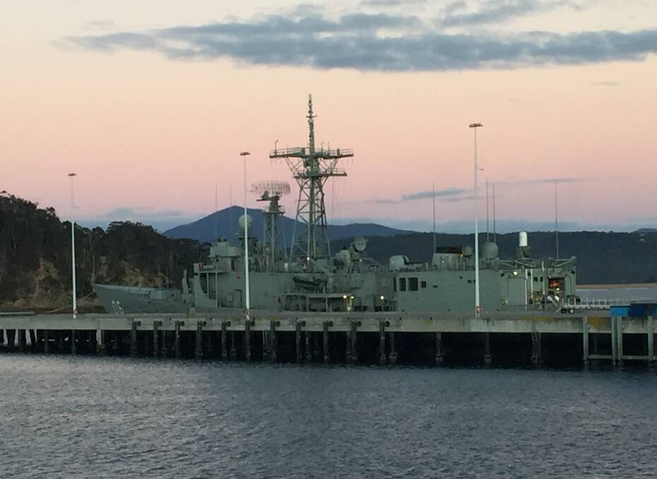 HMAS Newcastle at the navy wharf in Twofold Bay, opposite Eden. Picture: Scott Bevan