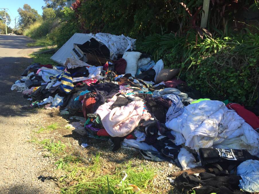 UNSIGHTLY: Piles of household waste in Beach Road, Wangi Wangi, and left in the residential area for weeks. 